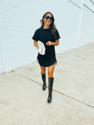 woman in black tshirt dress and black knee high boots