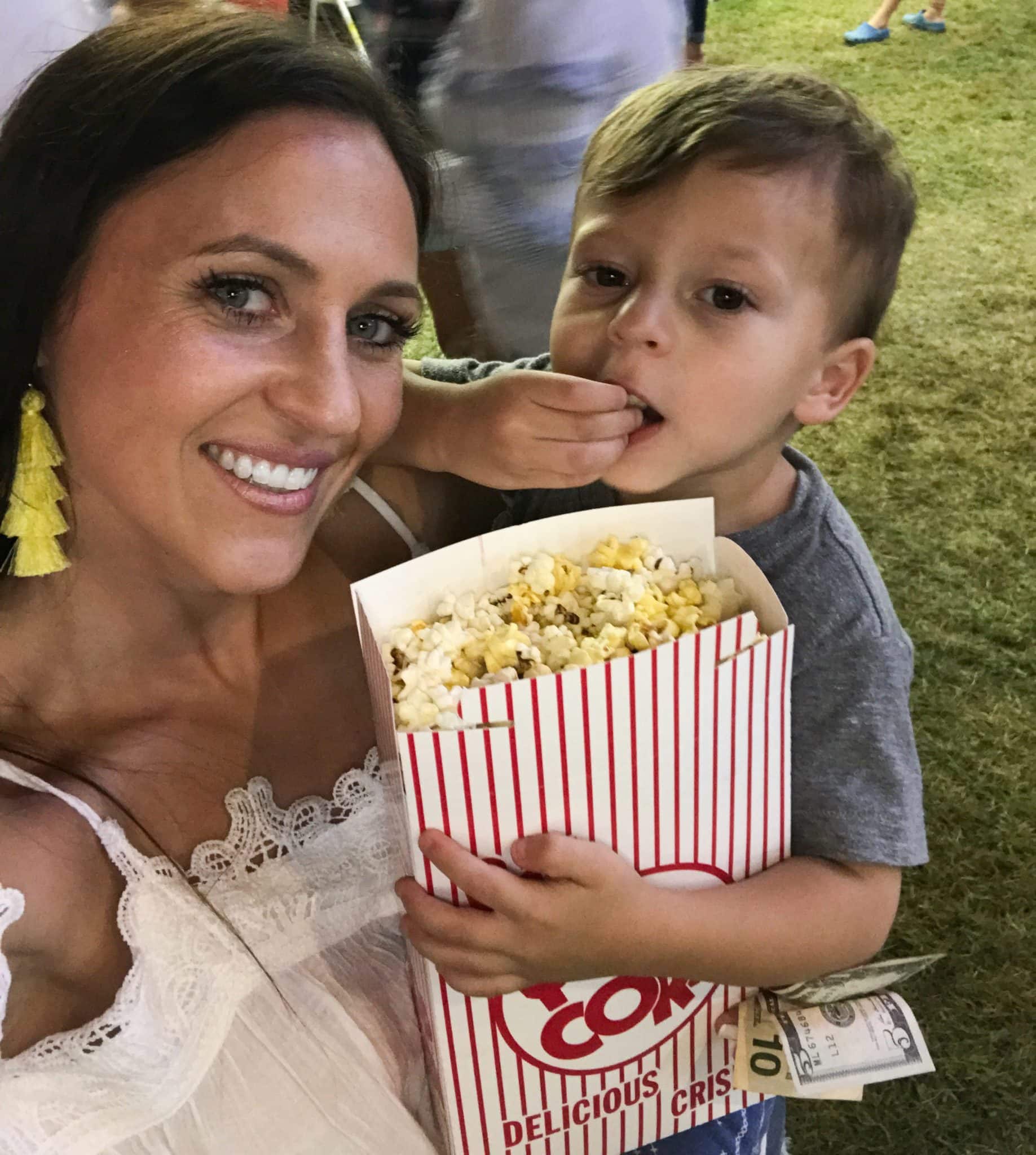mother and son eating popcorn