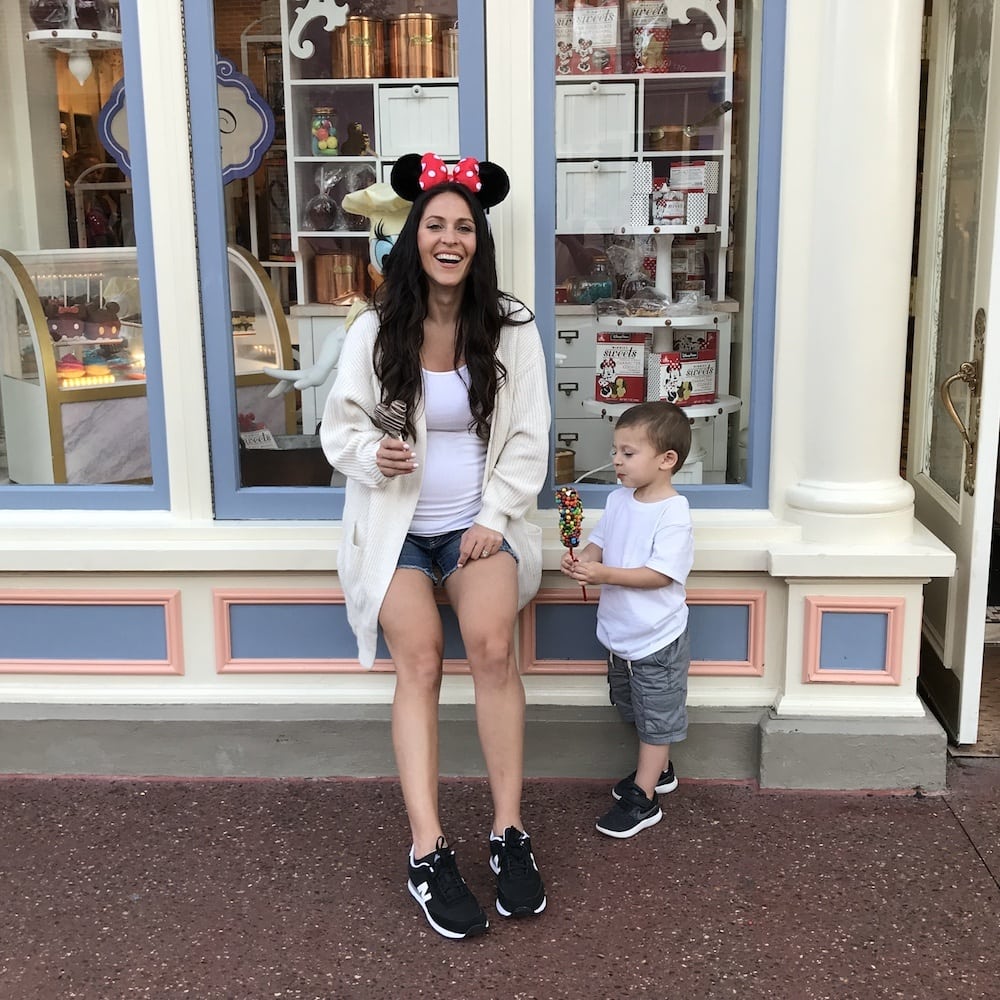 pregnant woman with son at Disney World
