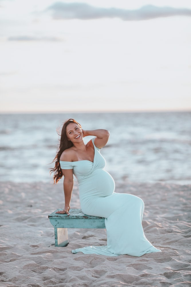 pregnant woman doing a beach maternity photoshoot