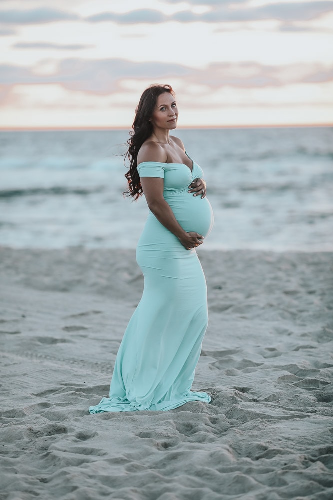 pregnant woman doing a beach maternity photoshoot
