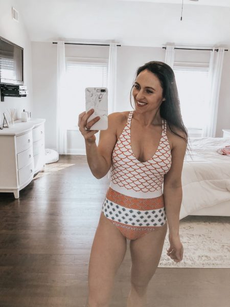 a woman taking a selfie in a one piece Cupshe swimsuit