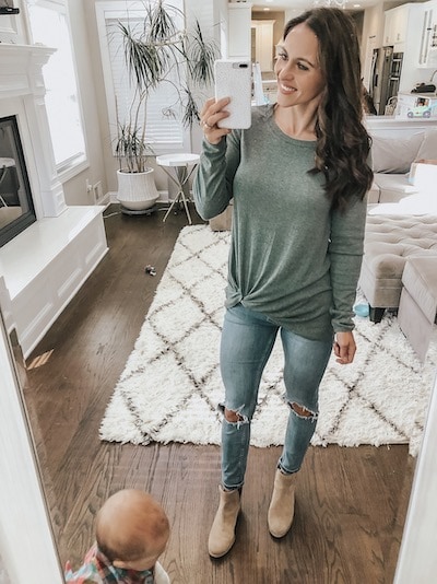 a woman wearing a gren knot front tee