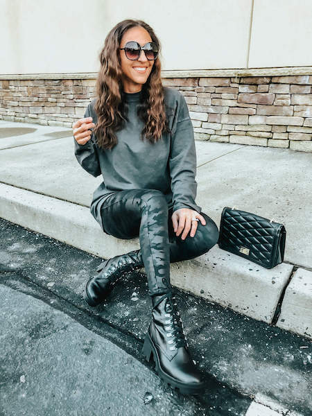casual outfit with camo leggings, combat boots, and black long sleeve t-shirt