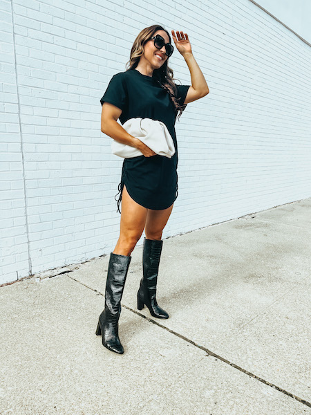 woman in black tshirt dress and black boots