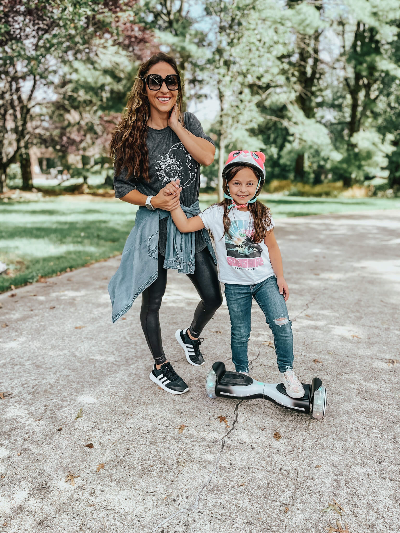 mom and daughter on hoverboard - outdoor gifts for kids