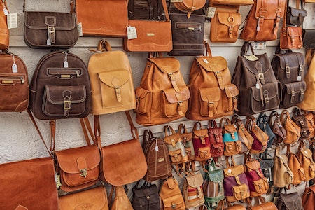 brown pocketbooks hanging on a wall