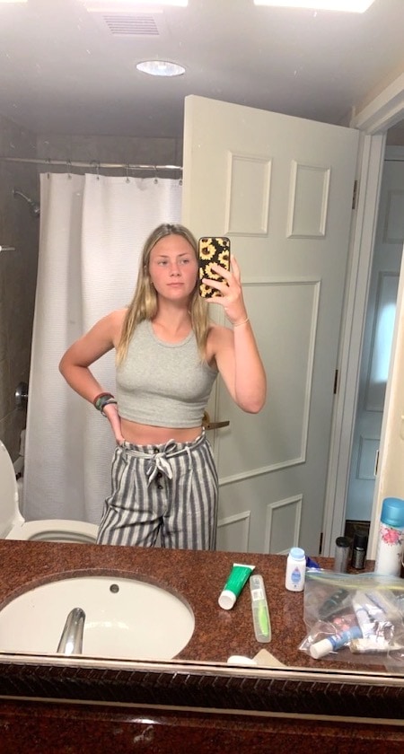 girl wearing striped pants and crop top