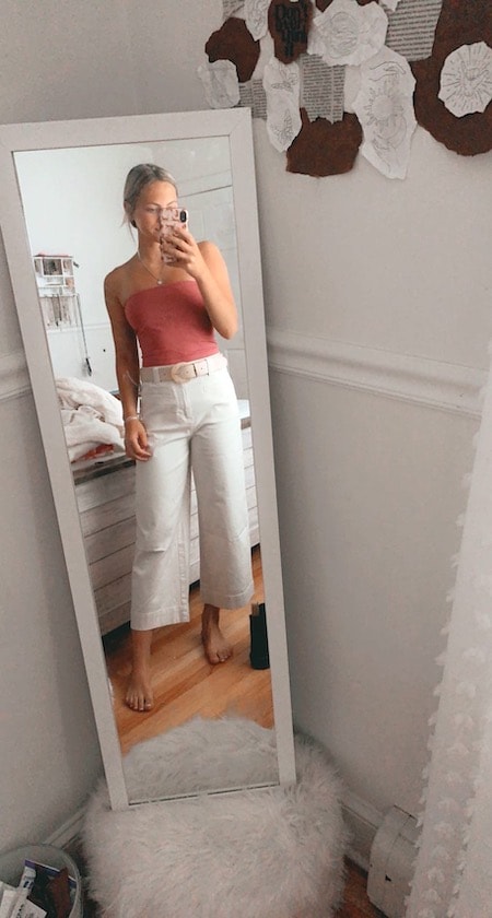 girl wearing white jeans and pink tube top
