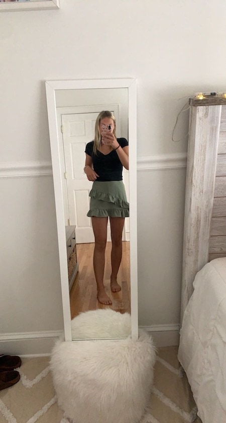 girl in green skirt and black top - outfit ideas for teen girls