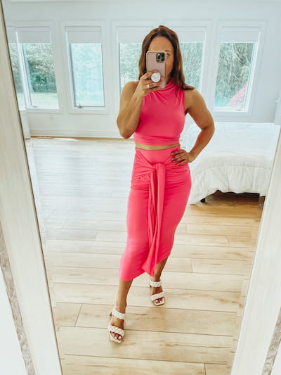 woman in pink skirt set outfit