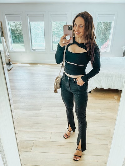 woman in black cutout top and black jeans outfit