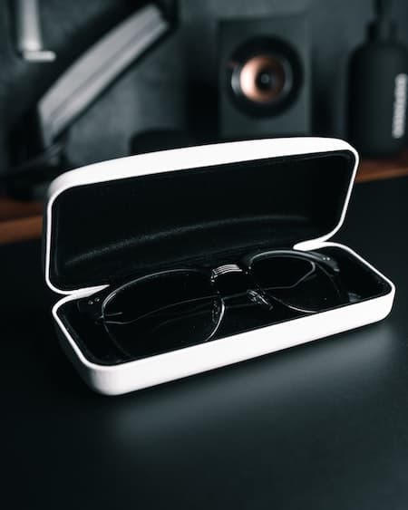 white glasses case with glasses inside