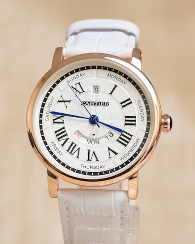 A white Cartier Watch