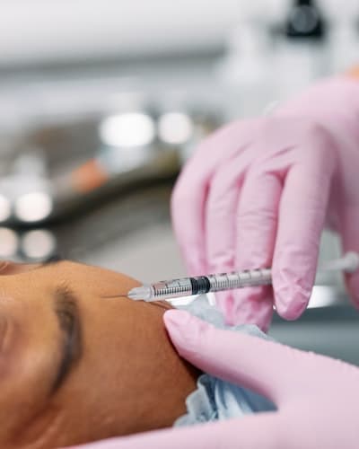 woman getting botox after microblading