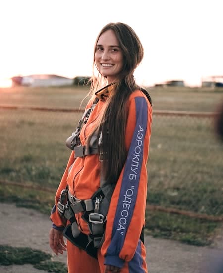 A woman wearing a skydiving jumpsuit.