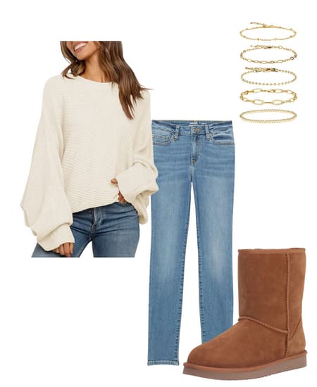 A women's outfit idea showing how to wear flat ankle boots with jeans and an oversized sweater.