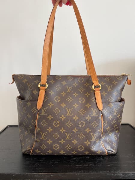 Women's Louis Vuitton "Totally MM" designer tote bag for work.