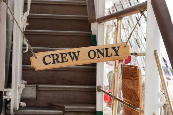 A crew only sign on a yacht.