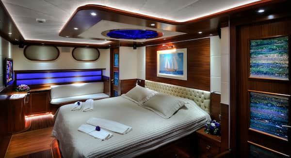 The interior of a yacht bedroom.
