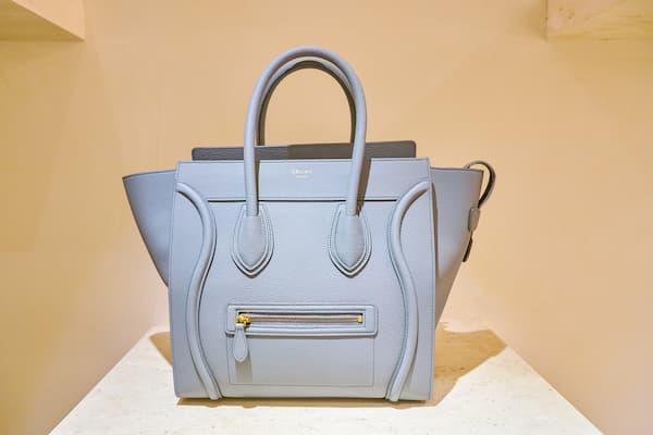 A light grey Celine handbag.
