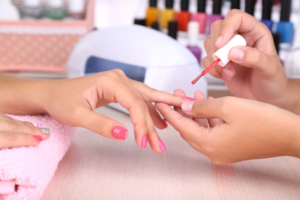 A woman getting a manicure.