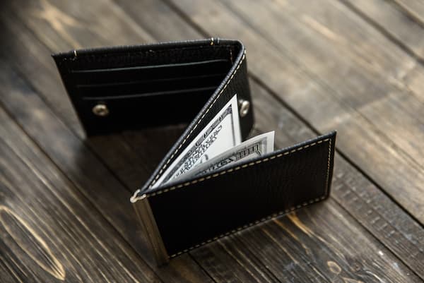 A slim black trifold wallet. 