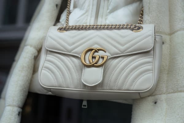 A white Gucci handbag.