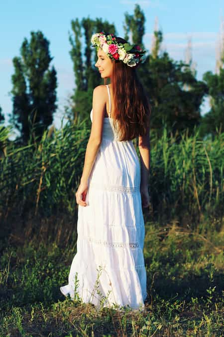A woman in a white bohemian dress.