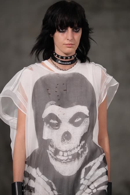 A woman wearing a skull t-shirt.
