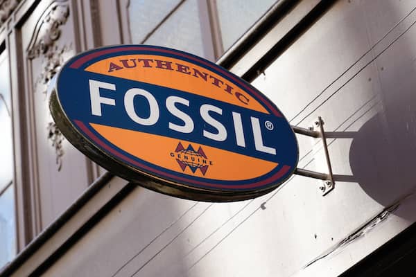 A Fossil brand logo above a storefront.