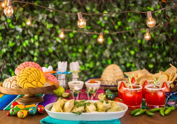 A table of food for a fiesta.