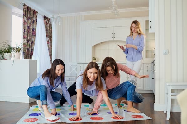 Women playing Twister.